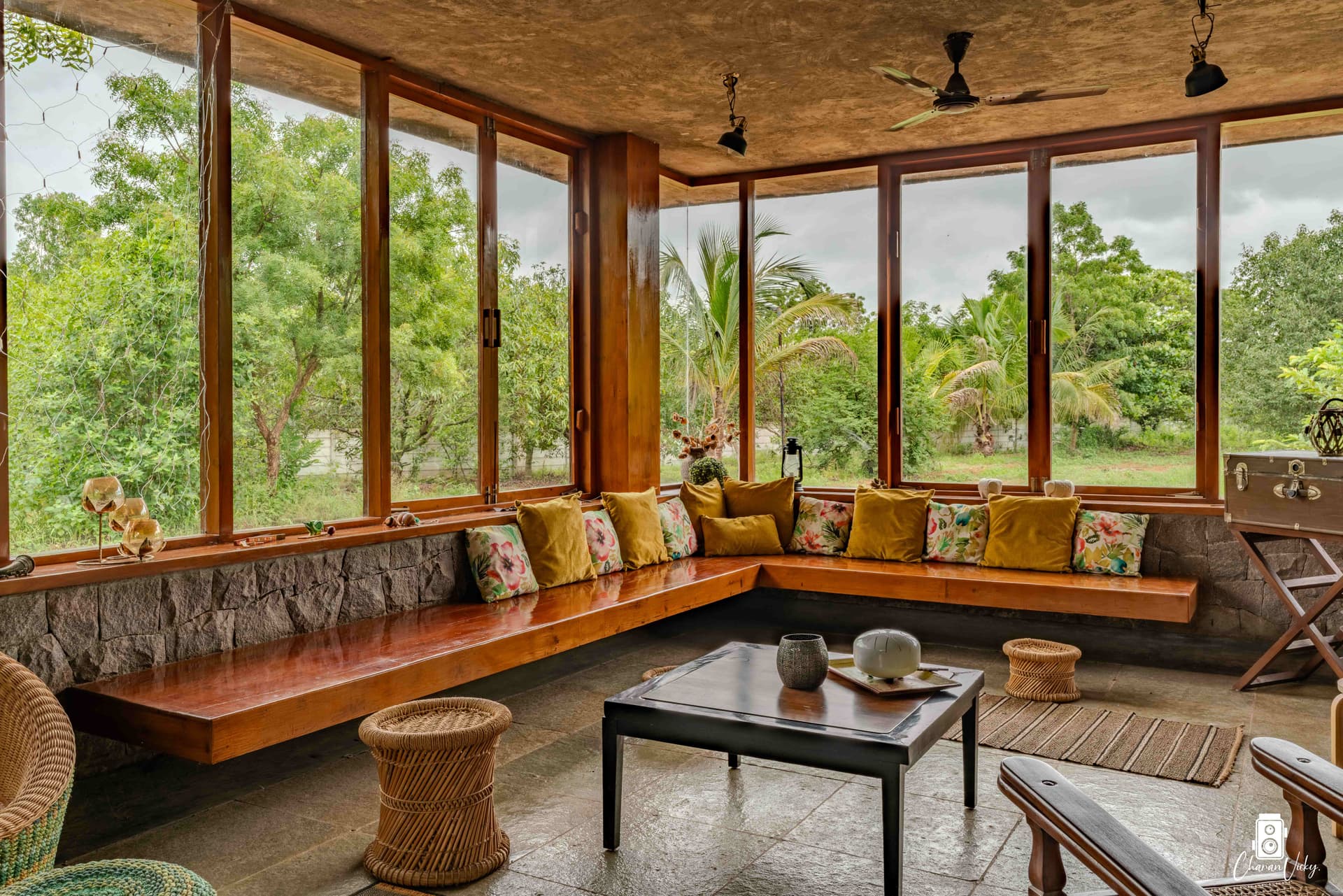 Corner window seat with yellow cushions