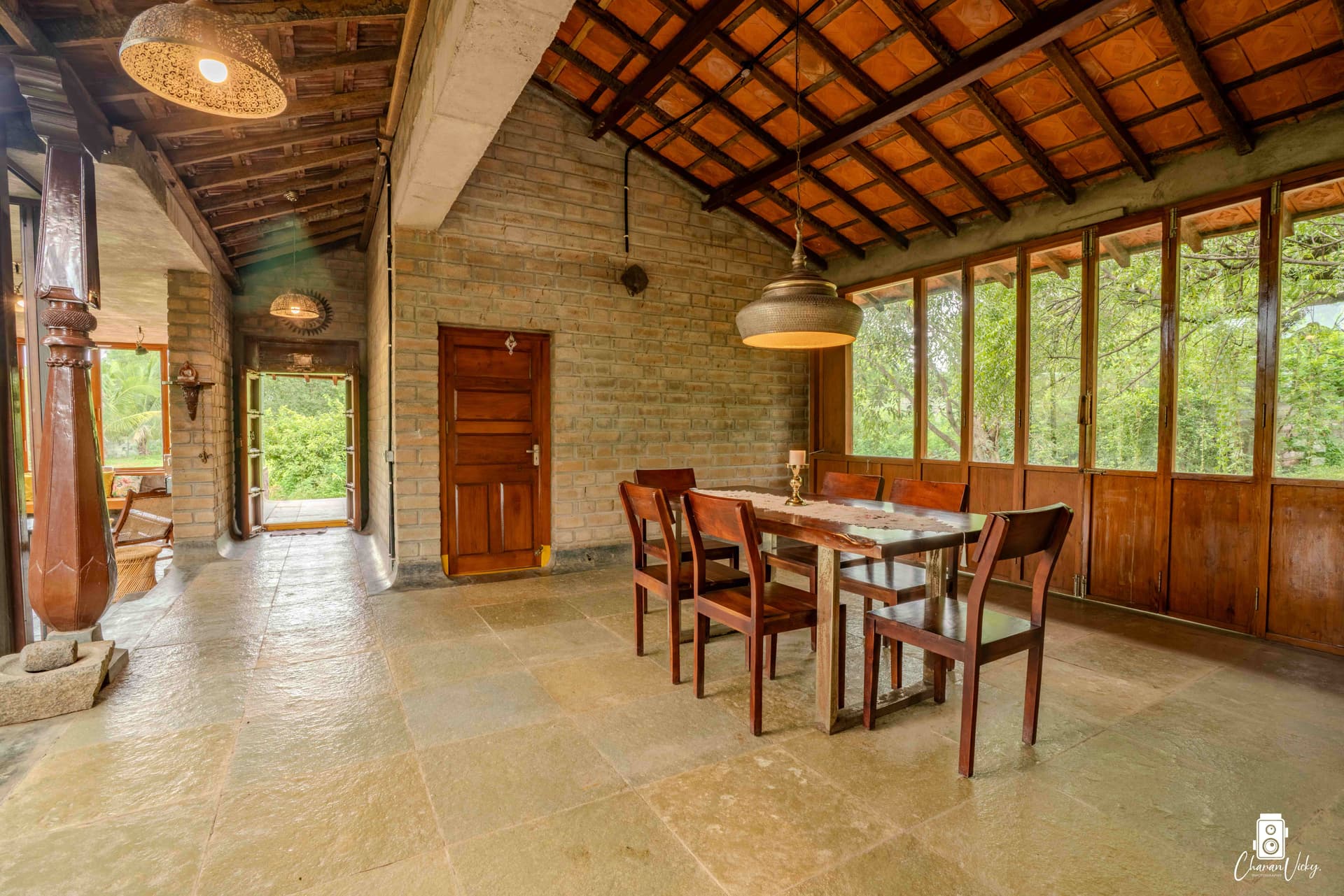 Dining area with carved pillar and open courtyard