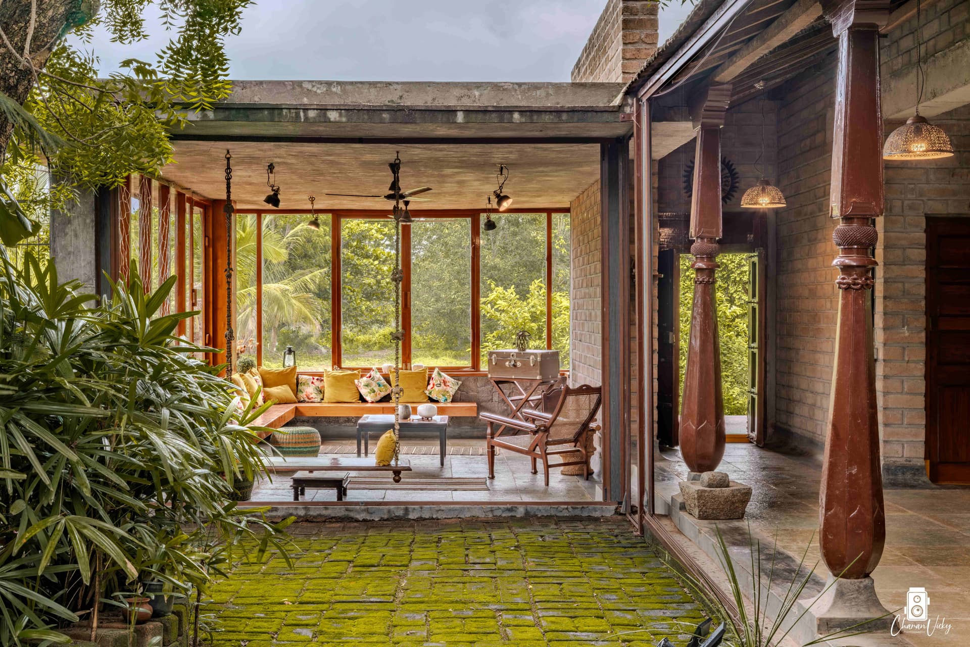 Moss-paved courtyard and sunlit living room